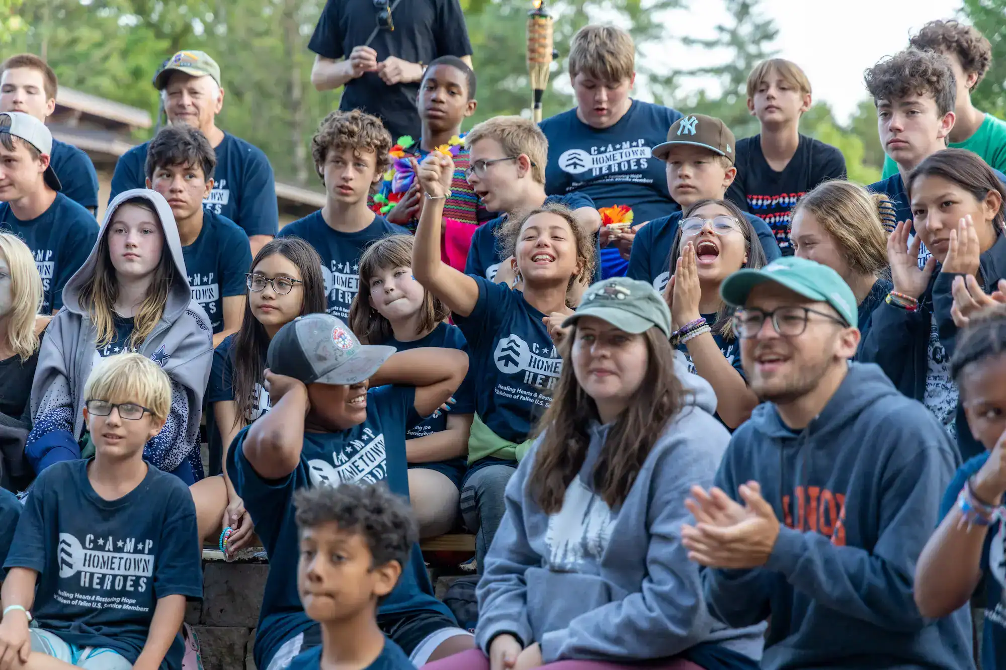 Camp kids and counselors cheering together