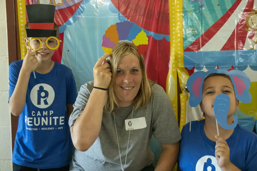 Camp Reunite Kids & Counselor dressing up and posing