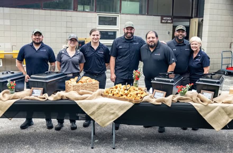 Sponsored Career Day Group with a large buffet table of catering