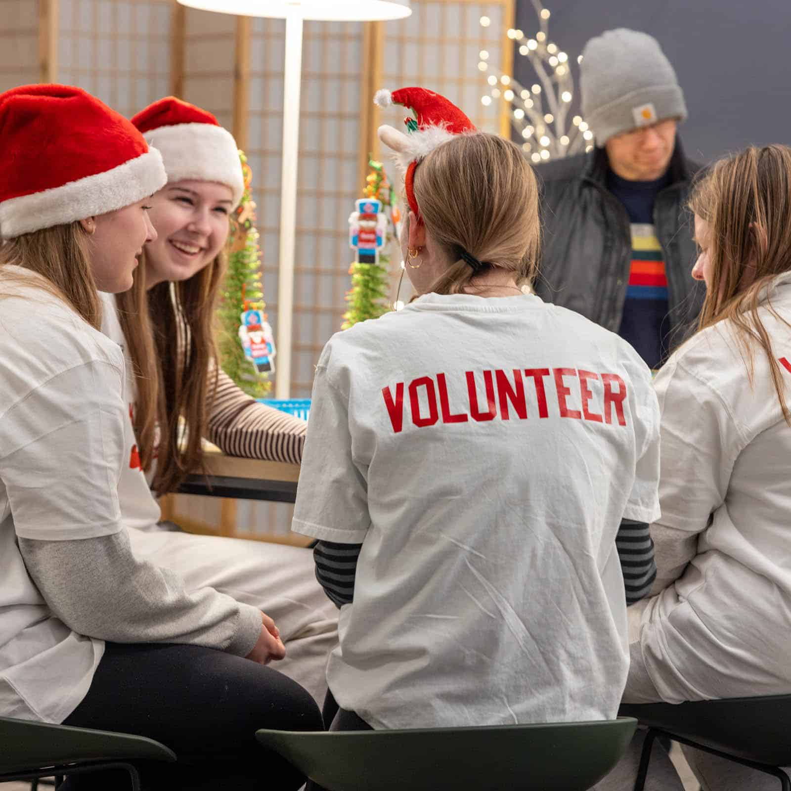 Kids2Kids Toy Drive Volunteers collaborating at a table