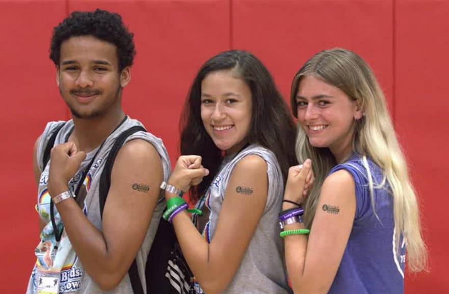 Camp Hometown Heroes Counselors flexing